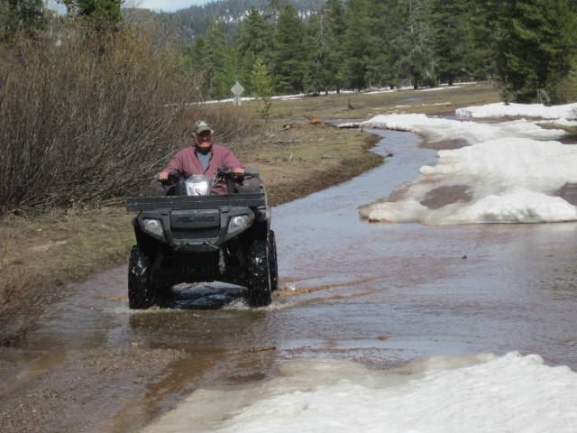 2014-05-17 14-19-10 (Small) Murray in Wyoming, bear hunt melting snow on road.JPG