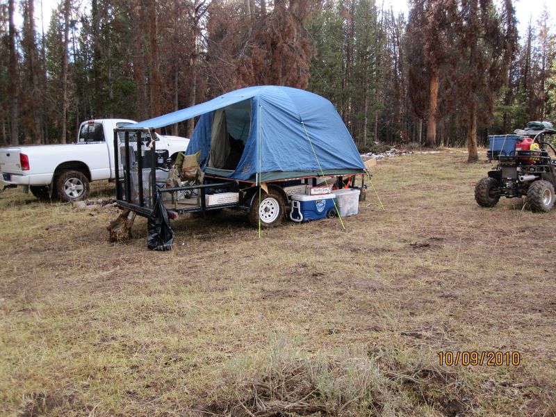 Camp trailer with tent.jpg